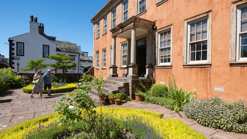 Two visitors in the garden at Wordsworth House, Cumbria in June